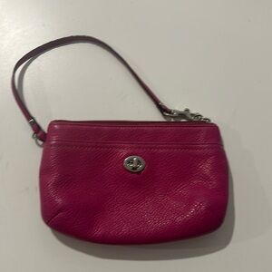 Coach leather wristlet in fuchsia pebbled leather, pre-loved
